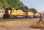 Loaded coal train rolls west